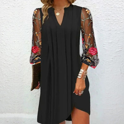 Mini dress with sheer sleeves and V-neck