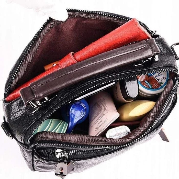 Finbjorg  Small and versatile bag in golden cognac shade