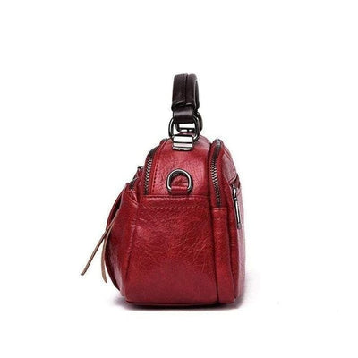 Finbjorg  Small and versatile bag in golden cognac shade