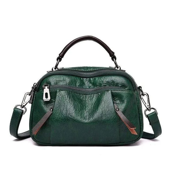 Finbjorg  Small and versatile bag in golden cognac shade