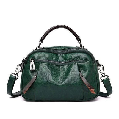 Finbjorg  Small and versatile bag in golden cognac shade
