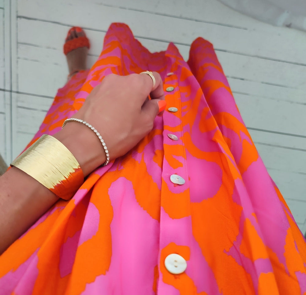 Midi dresses with front buttons in warm pink and orange