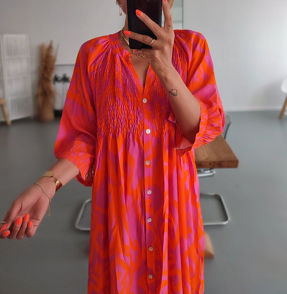 Midi dresses with front buttons in warm pink and orange