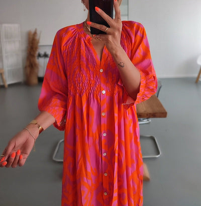 Midi dresses with front buttons in warm pink and orange