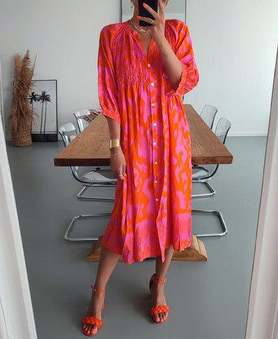 Midi dresses with front buttons in warm pink and orange