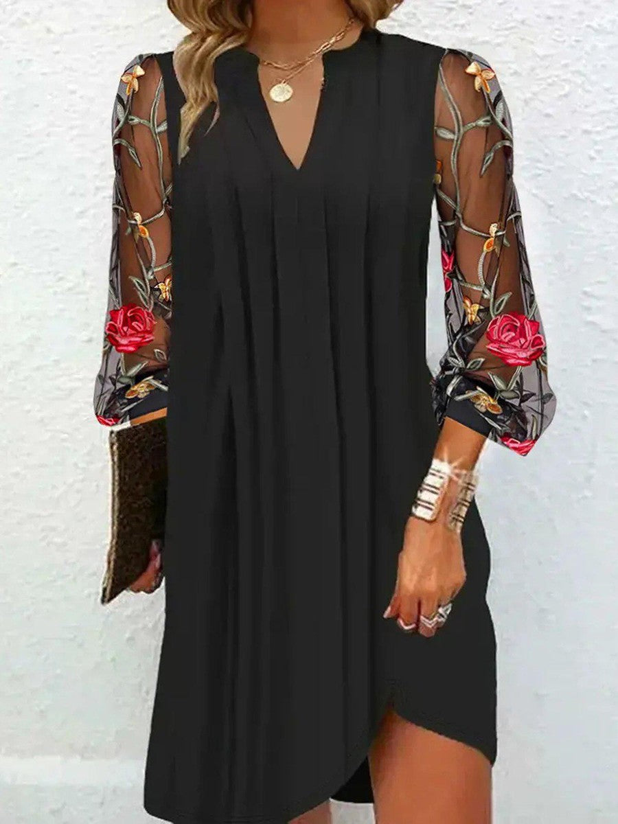 Mini dress with sheer sleeves and V-neck