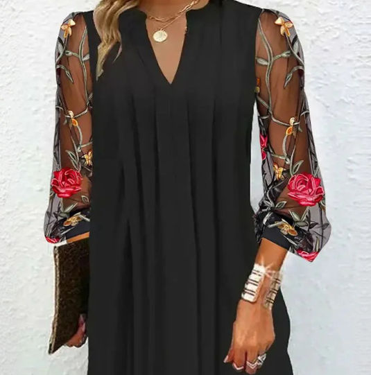 Mini dress with sheer sleeves and V-neck